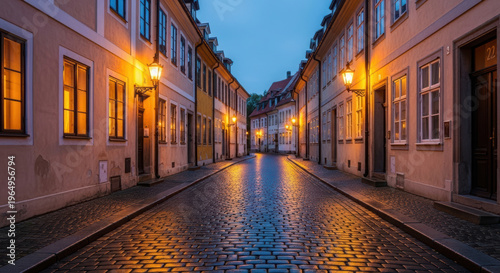 Evening glow illuminates a quiet cobblestone street in a historic town