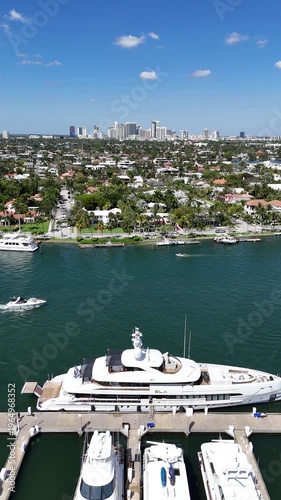 Boats cruising in the intracoastal waterway with downtown Fort Lauderdale in the distance in Broward County, Florida.