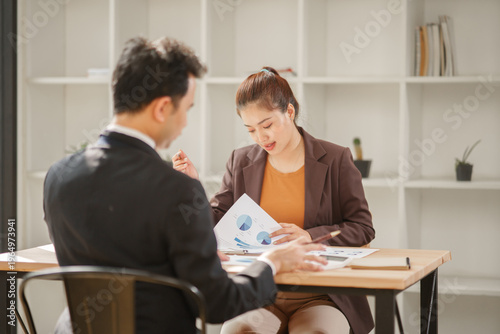 Professional Asian Businesswoman Conducting an Interview or Meeting in a Modern Office
