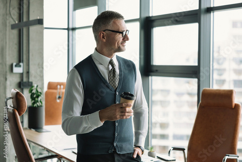 Coffee break. Businessman in corporate office. Business man at coffee break. Businessman relaxing with coffee cup. CEO having free time. Business break for drinking. Businessman drinking coffee