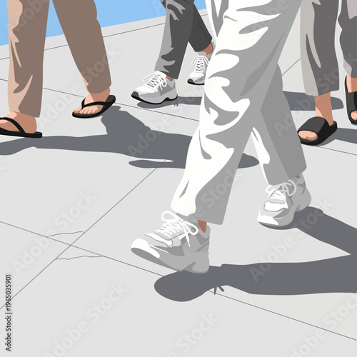People walking on a sidewalk on a sunny day with shadows