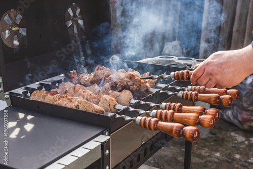The meat is grilled outside on a barbecue