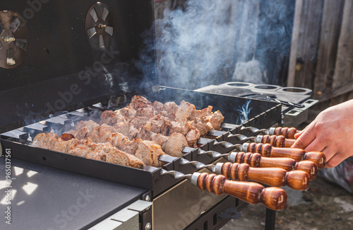 The meat is grilled outside on a barbecue