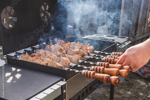 The meat is grilled outside on a barbecue