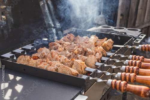 The meat is grilled outside on a barbecue