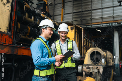 professional technician engineer with safety helmet hard hat working in industrial manufacturing factory, men at work to checking equipment of machinery production technology or construction operating