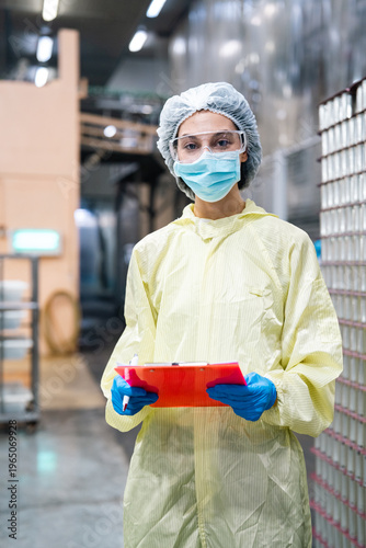 Food factory laboratory industry production quality inspection safety hygiene technician manufacturing workers checking industrial processing equipment in stainless facility, food quality control