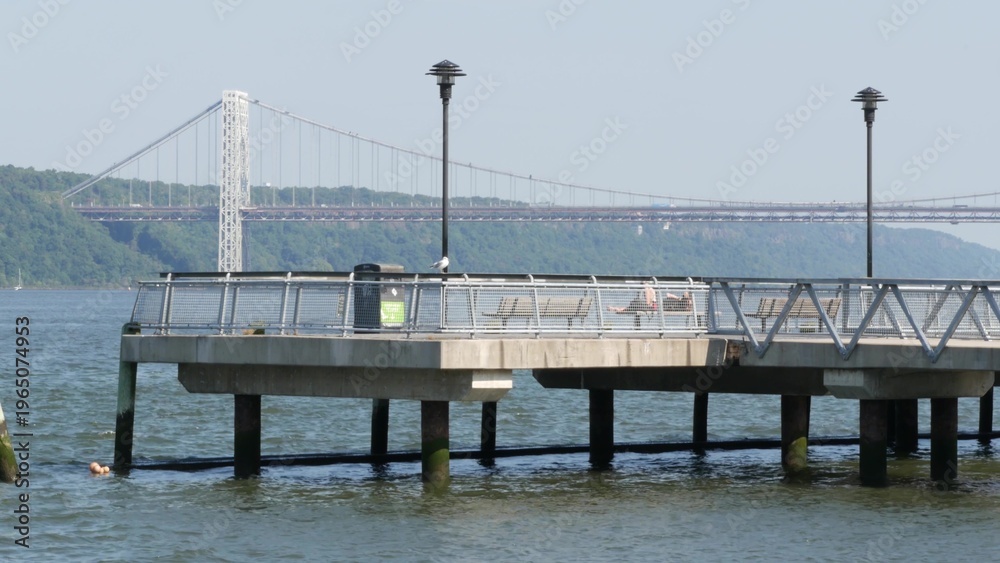 Obraz premium George Washington bridge, Hudson river in New York City, United States of America. Transport bridge architecture, riverside park pier in West Harlem. Waterfront promenade near river water. USA nature.