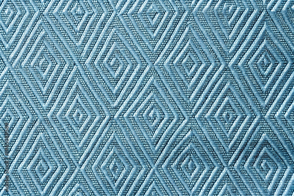 Fototapeta premium Natural light blue geometric diamond pattern quilted fabric texture closeup