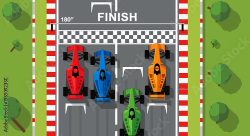 Top-down view of four racing cars crossing the finish line on a grey asphalt track with a checkered pattern and green grassy banks.