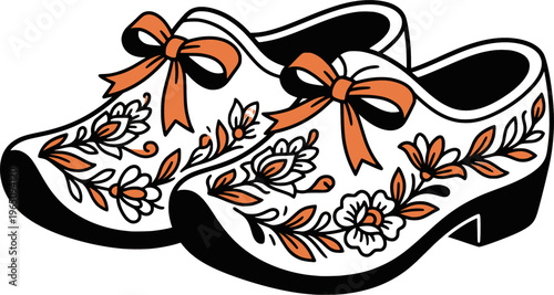 Dutch wooden clogs with orange ribbons and blooming flowers
