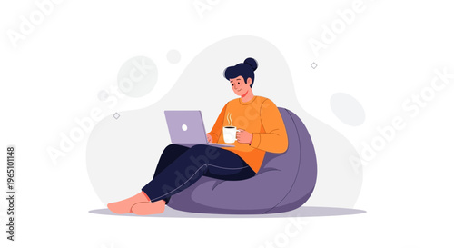 Young man working on laptop while relaxing on bean bag chair with coffee