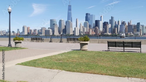 New York City Manhattan Downtown Financial District skyline, World Trade Center tower, cityscape from New Jersey Liberty state park, United States. Hudson river waterfront walkway, skyscraper building