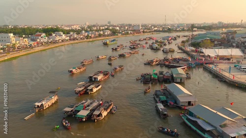 Aerial view of Cai Rang floating market, Can Tho, Vietnam. It is famous market in Mekong Delta, Vietnam. Tourists have breakfast on a boats, buy and sell food, vegetable, fruits on boat, ship