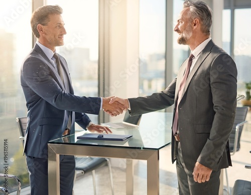 Business Handshake and Agreement Between Two Professional Men in Modern Office After Meeting