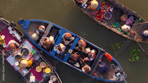 Aerial view of Cai Rang floating market, Can Tho, Vietnam. It is famous market in Mekong Delta, Vietnam. Tourists have breakfast on a boats, buy and sell food, vegetable, fruits on boat, ship