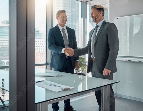 Business Handshake and Agreement Between Two Professional Men in Modern Office After Meeting