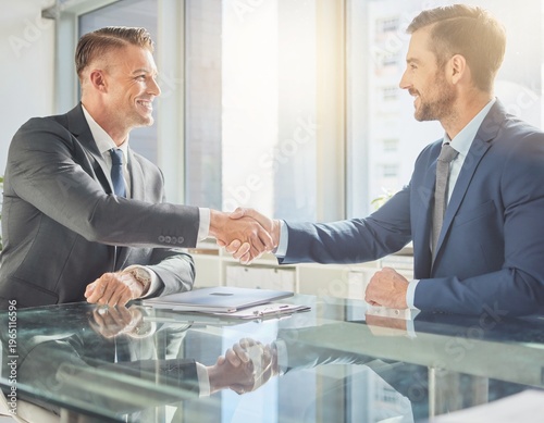 Business Handshake and Agreement Between Two Professional Men in Modern Office After Meeting
