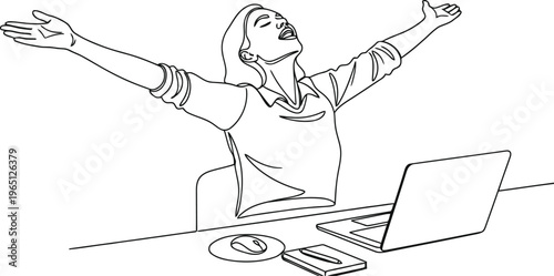 Woman celebrates success with arms raised in front of laptop