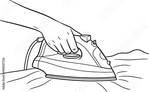Hand holding an electric iron smoothing out wrinkles on fabric
