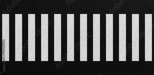 Top view of zebra crosswalk with white pedestrian stripes on dark asphalt road surface