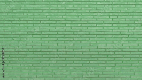 Vibrant green brick wall texture creating a modern and refreshing background, ideal for design projects requiring a solid, repeating pattern and cool aesthetic