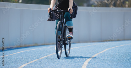 Photography Woman riding road bike at the outdoor stadium