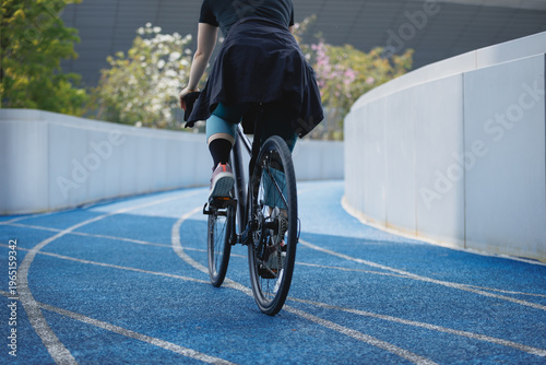Photography Woman riding road bike at the outdoor stadium