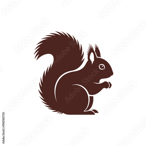 Brown squirrel sitting, holding a nut in nature