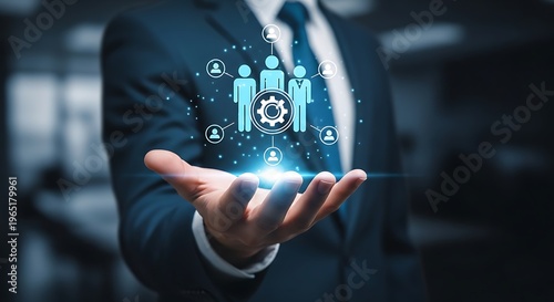 Businessman holding hand with network and gear hologram