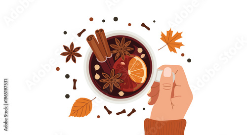 Overhead view of a person holding a hot cup of mulled wine filled with spices and orange slices surrounded by autumn leaves and cloves.