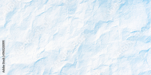Light blue crumpled paper texture background with white highlights and soft folds