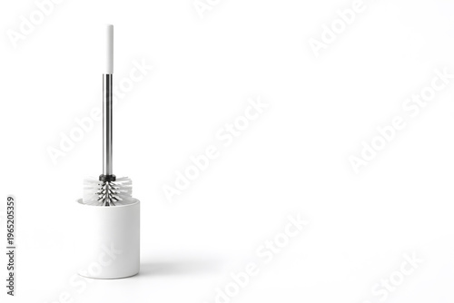 Toilet brush cleaning tool minimal white background with copy space modern bathroom hygiene accessory
