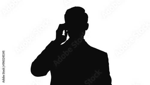 Silhouette of a man in business attire holding a mobile phone to his ear on white.