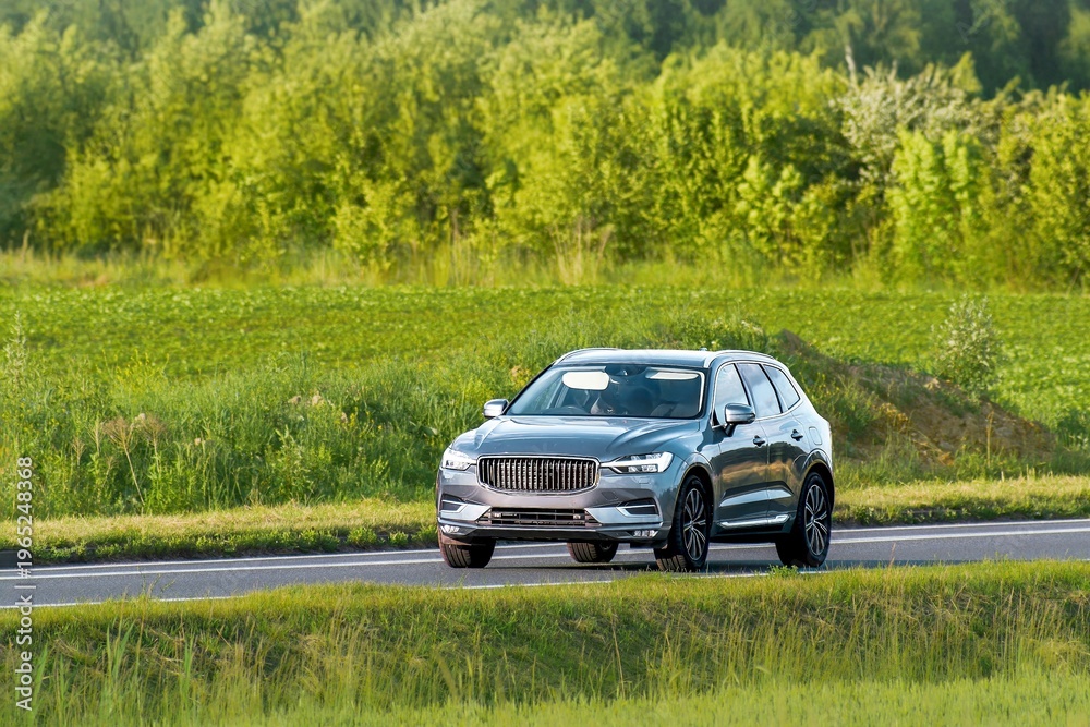 Fototapeta premium Premium crossover vehicle on quiet countryside road