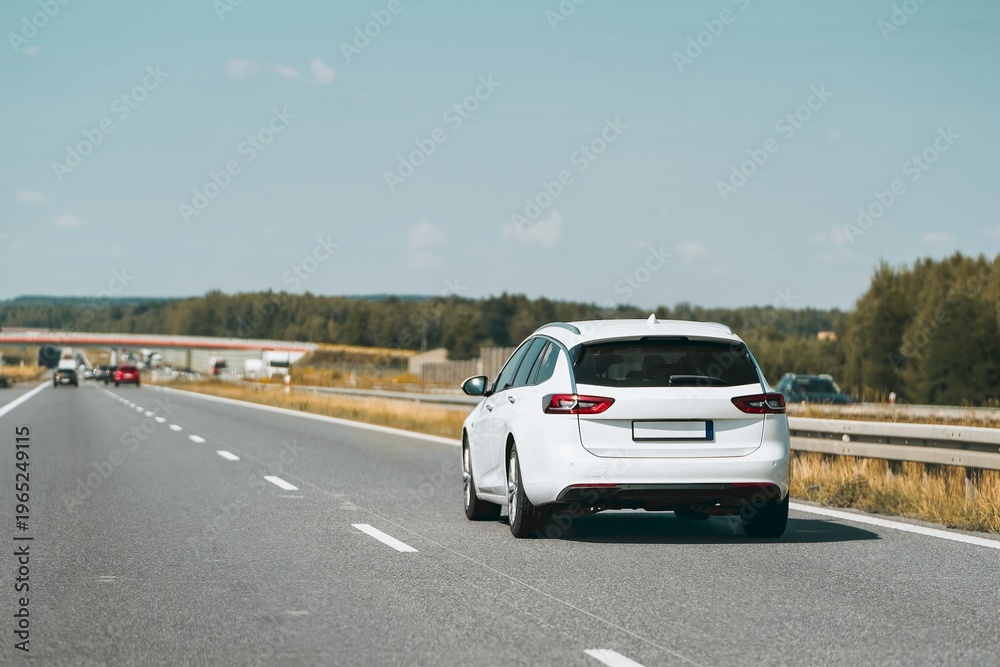 Fototapeta premium Rear view of station wagon on open highway