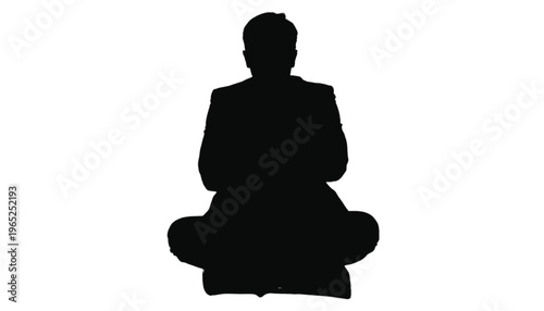 Businessman silhouette sits cross-legged in meditative posture suggesting calm focus or yoga practice.