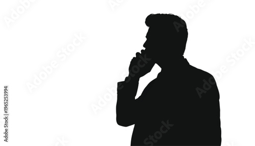 Silhouette of a person holding a mobile phone to their ear communicates an important business conversation.