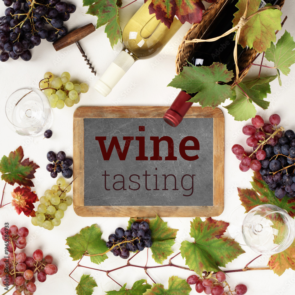 Fototapeta premium Wine Tasting Chalkboard with Grapes and Bottles Flat Lay