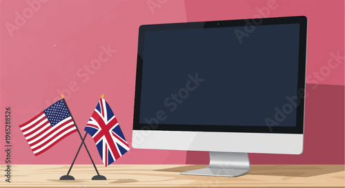 Desktop computer and crossed flags of US and UK on wooden surface