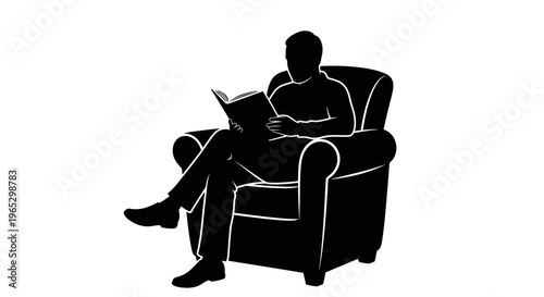 Man sitting on armchair reading book.