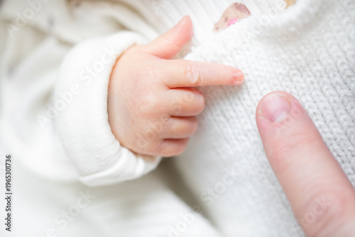 Wallpaper Mural Close-up of Newborn Baby Touching Parent's Finger Torontodigital.ca