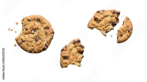 Obraz na plátne Broken chocolate chip cookies and crumbs, some bitten, isolated on a transparent background for indulgent snack designs
