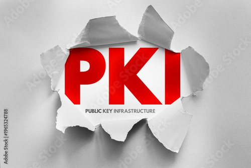 PKI Public Key Infrastructure text shown through torn paper design, cybersecurity concept representing certificate management, trust models, identity verification and secure communication architecture