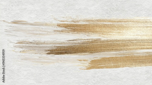 Gold paint brush stroke on white textured paper. Abstract artistic background for luxury design. Greeting card wallpaper with metallic texture. Elegant creative element for holiday.
