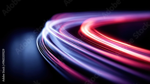 Abstract glowing light trails in motion, representing speed and technology