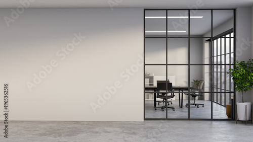 Potted plant on grey stone floor corridor aside glass wall and white wall of meeting room in office.