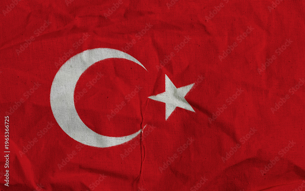 Obraz premium Turkish Flag On Textured Red Fabric With White Crescent And Star Symbol Close-Up