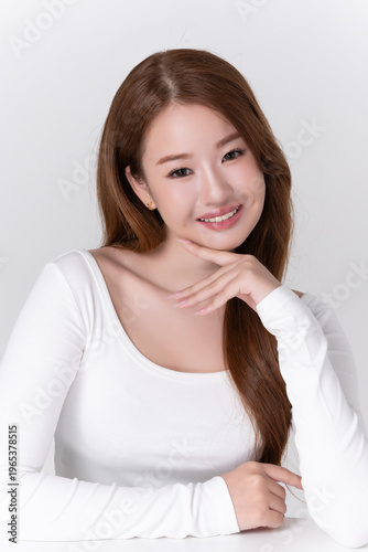 portrait beautiful young asian woman with brunette hair, healthy glowing facial skin and natural makeup on white background, for advertising cosmetics and beauty concept.