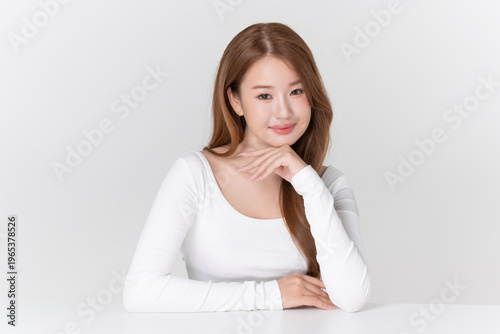 Portrait beautiful young asian woman with brunette hair, healthy glowing facial skin and clean makeup on white background, for advertising cosmetics and beauty concept.